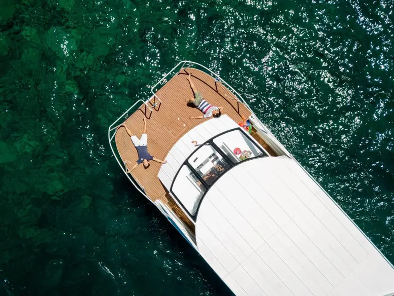 Speedboat crossing turquoise water on one of our sea tours