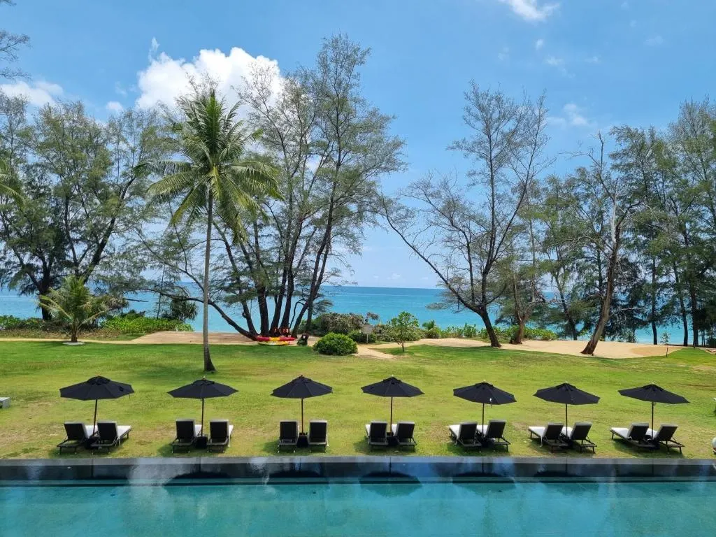 Resort pool deck overlooking the sea at one of the Phuket properties we manage